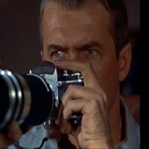 Jimmy Stewart looking through his camera in Rear Window