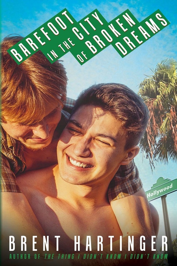 Cover of Barefoot in the City of Broken Dreams by Brent Hartinger. Two shirtless hunks embrace in front of a street sign that says Hollywood