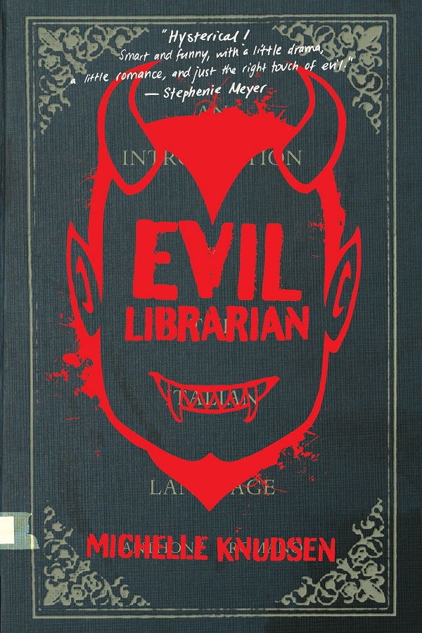 Cover of Evil Librarian by Michelle Knudsen. An Italian textbook with a devil's face scrawled on it
