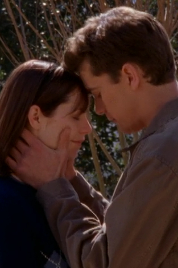 Pacey hugs Andie, cradling her face, as they say goodbye