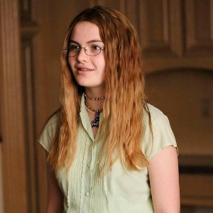 Jeanette, a nerdy looking girl with long brown hair and glasses