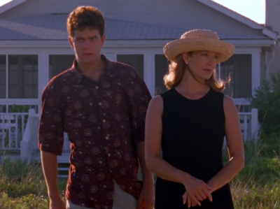 Pacey and Tamara stand next to each other, staring in different directions and looking unhappy