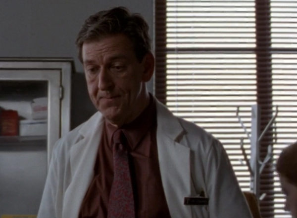 Jim Jansen, a friendly looking older white man wearing a doctor's white coat