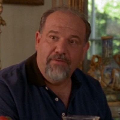 Alan Blumenfeld, a large older man with thinning hair and a goatee, as Sean's dad