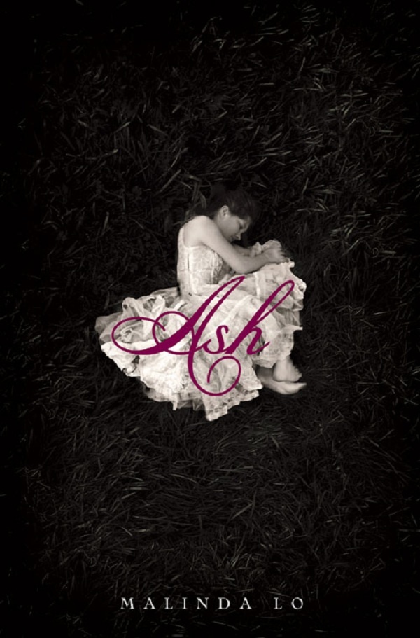 A girl in a white dress lies on her side in a ball on a solid black background. The title of the book is printed over her.