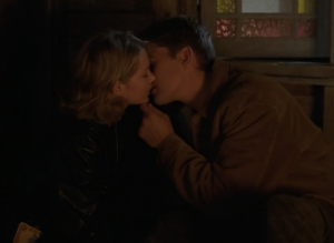 Pacey and Jen kiss in the dark corner of the Witch Island gift shop