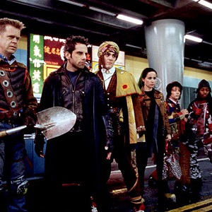 The cast of Mystery Men all dressed in different quirky outfits in the subway