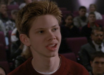 Actor Lee Norris sits in the auditorium