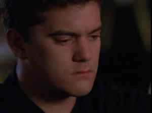 Pacey stares off with a stoic but heartbroken look on his face, a single tear on his handsome cheek.