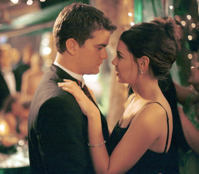 Joey and Pacey slow dance, faces almost touching, Joey in a beautiful black dress and updo and Pacey in a nice suit. They're surrounded by twinkly lights and the tension between them is palpable.