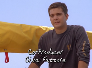 Pacey stands on his boat with a sharp-looking new haircut.
