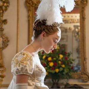 Daphne from Bridgerton bowing to the queen in a fancy white dress at her debut to Society