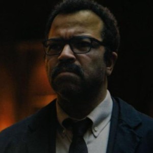 Jeffrey Wright, a middle-aged Black man with glasses, wearing a suit and tie and glasses