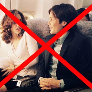 Two characters from Red Eye sitting next to each other on a plane (one is a hired killer) with an X through the image.
