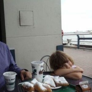 Sophie enjoying beignets