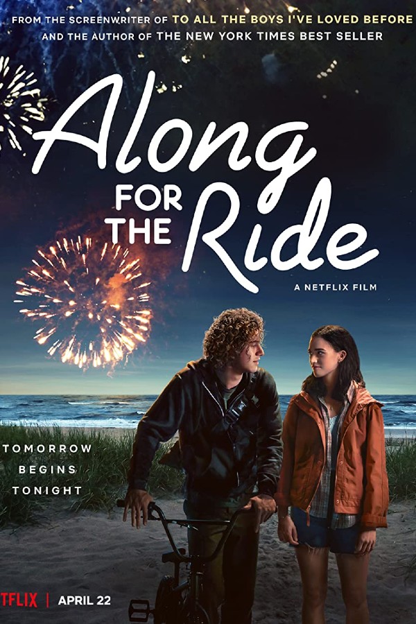 Poster for Along for the Ride, with Eli and Auden walking on the beach with fireworks behind them