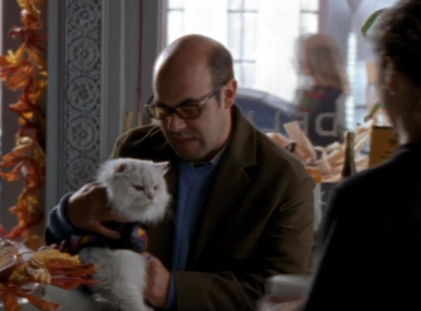 Javier holding a big white fluffy cat