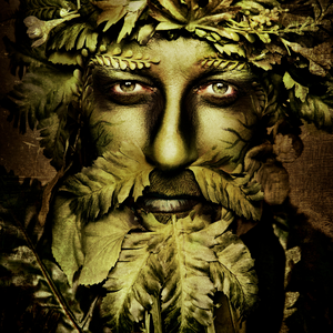 A literal green-colored man whose hair and facial hair are made out of leaves