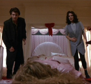 Christian Slater and Wynona Rider from Heathers standing over the dead body of a Heather