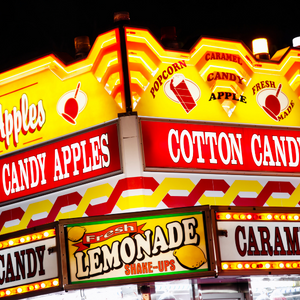 Signs at a carnival or fair for Lemonade, Cotton Candy and more.