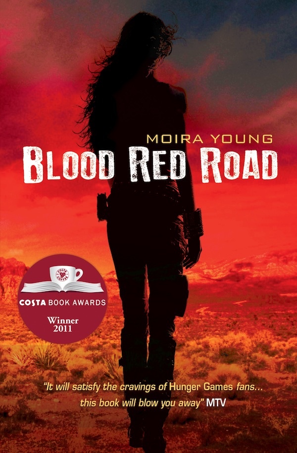 The silhouette of a woman walking in a bright red wasteland.