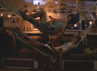 Joey and Pacey lie in hammocks on his boat