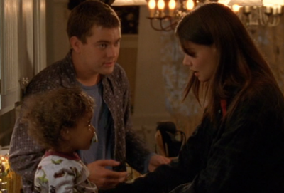 Joey and Pacey sit with Alexander, Pacey's arm cutely around the kid