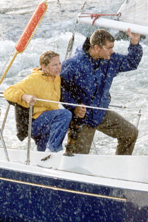 Jen and Pacey brace themselves on the deck of Pacey's boat as a wild storm whips them to and fro