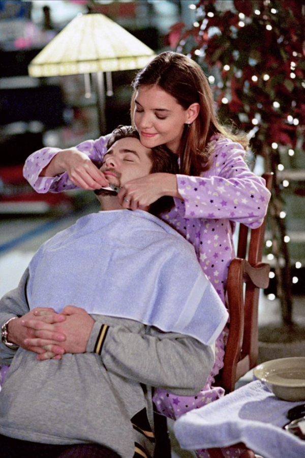Joey and Pacey are both in PJs at a department store, and Pacey sits in a chair with a towel around his chest while Joey stands behind him, shaving off his goattee