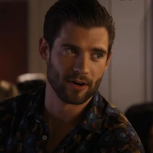 David Corenswet, a handsome white man with a close cut beard and brown hair