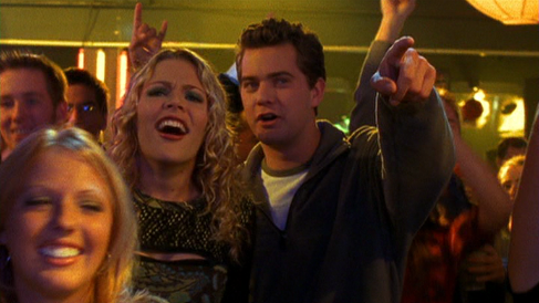 Pacey and Jen cheering in the audience at a club, watching Joey sing onstage (off-camera)