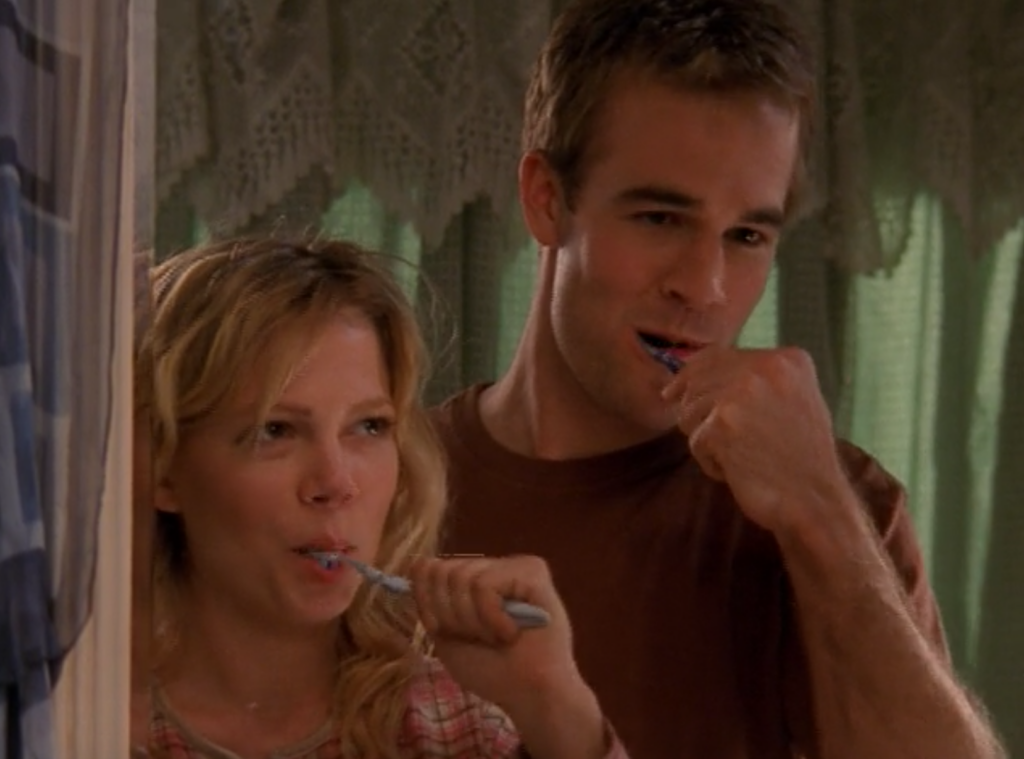 Jen and Dawson brush their teeth side-by-side in the bathroom, smiling cutely at each other in the mirror, just like that scene in BRING IT ON