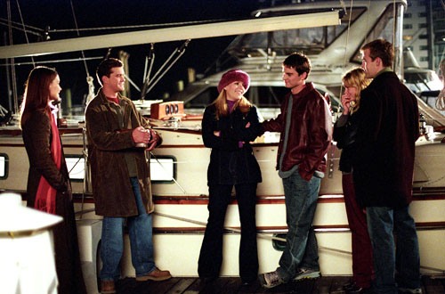 Dawson's crew hangs out on the dock next to Pacey's houseboat