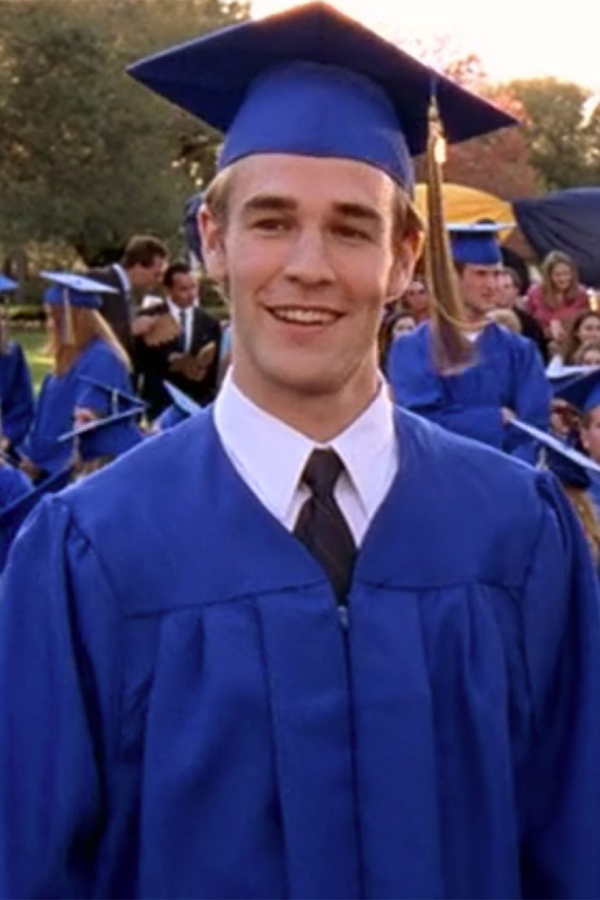 Dawson smiling in a graduation cap and gown