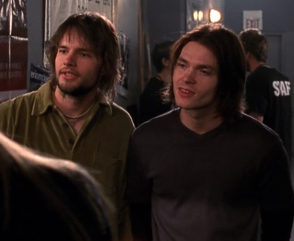 Extremely typical early 2000s indie rock guys with shaggy hair and weird beards