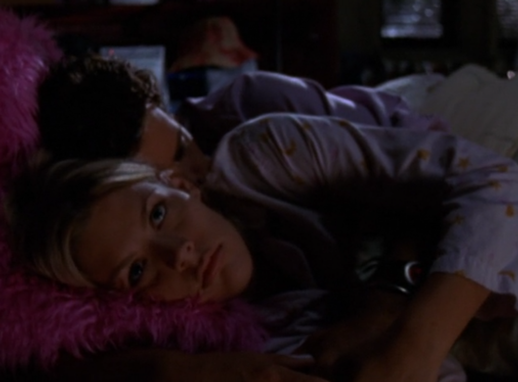 Pacey and Audrey lying in bed, with Audrey looking miserable