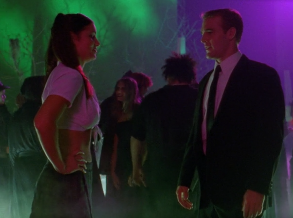 Natasha and Dawson at a Halloween party. They both look hot: Natasha's dressed as "Hit Me Baby"-era Britney and Dawson's in a suit