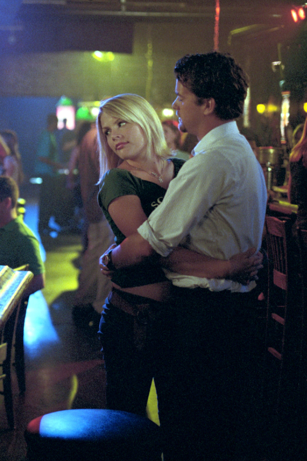 Audrey and Pacey hug at the bar