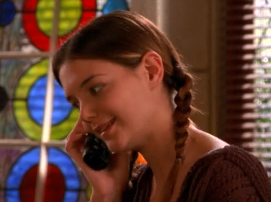 Joey, on the phone, with adorable pigtail braids