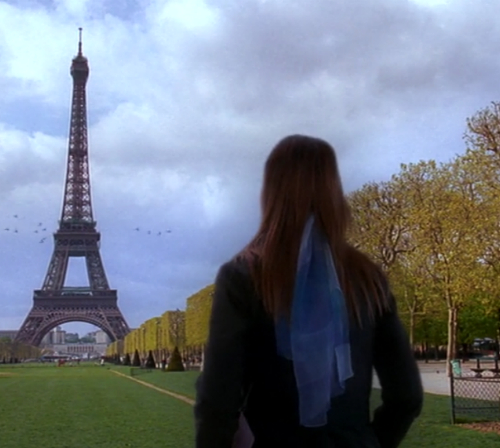Joey stands in front of the Eiffel Tower