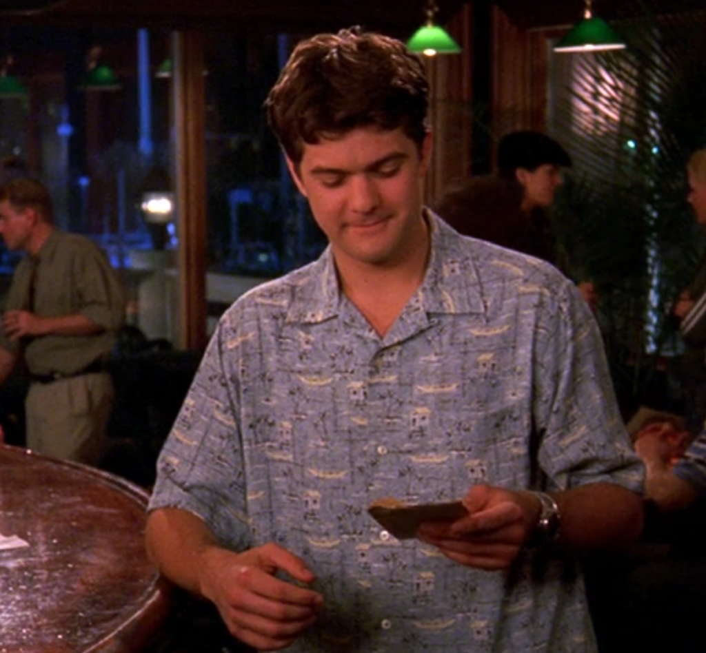 Pacey at Leery's Fish House in a very early-Pacey shirt: a baggie, ugly printed button-down