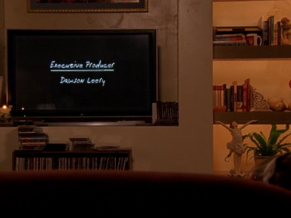 A TV that reads "Executive Producer: Dawson Leery" in the same font and style as EP Kevin Williamson's real Dawson's Creek credits  