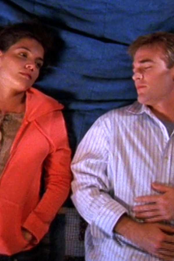 Joey and Dawson lying side-by-side in his bed, the way they used to in the old days. He's asleep, and she's looking off thoughtfully