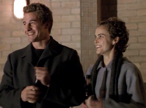 Felicity and Ben, standing by the UNY pool and grinning mischievously