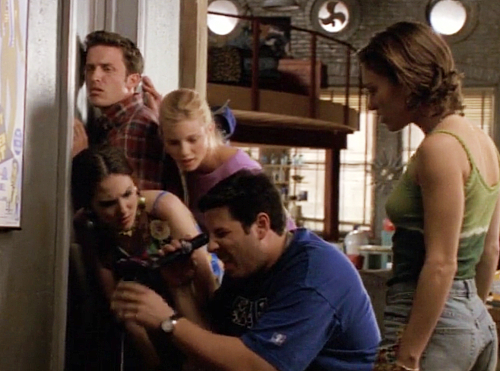 Richard, Ruby, Meghan, Sean and Julie all listening outside a bedroom door in the loft