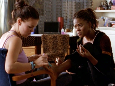 Jane painting Elena's toes as they gossip cutely