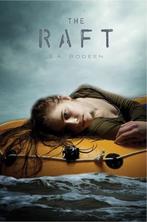A girl laying on top of a yellow life raft in water.