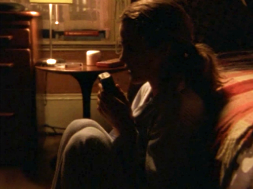 Another classic FELICITY silhouette, curled up on the floor in shadows, recording a tape for Sally