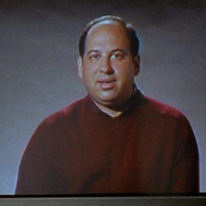 Michael Kostroff, a slightly pudgy white man with balding brown hair
