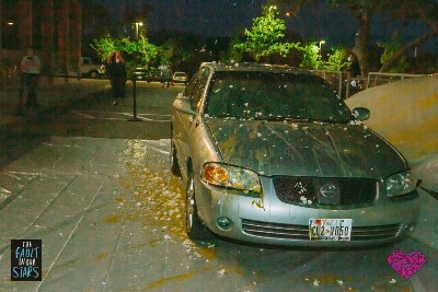 A car completely covered in yolks and egg shells